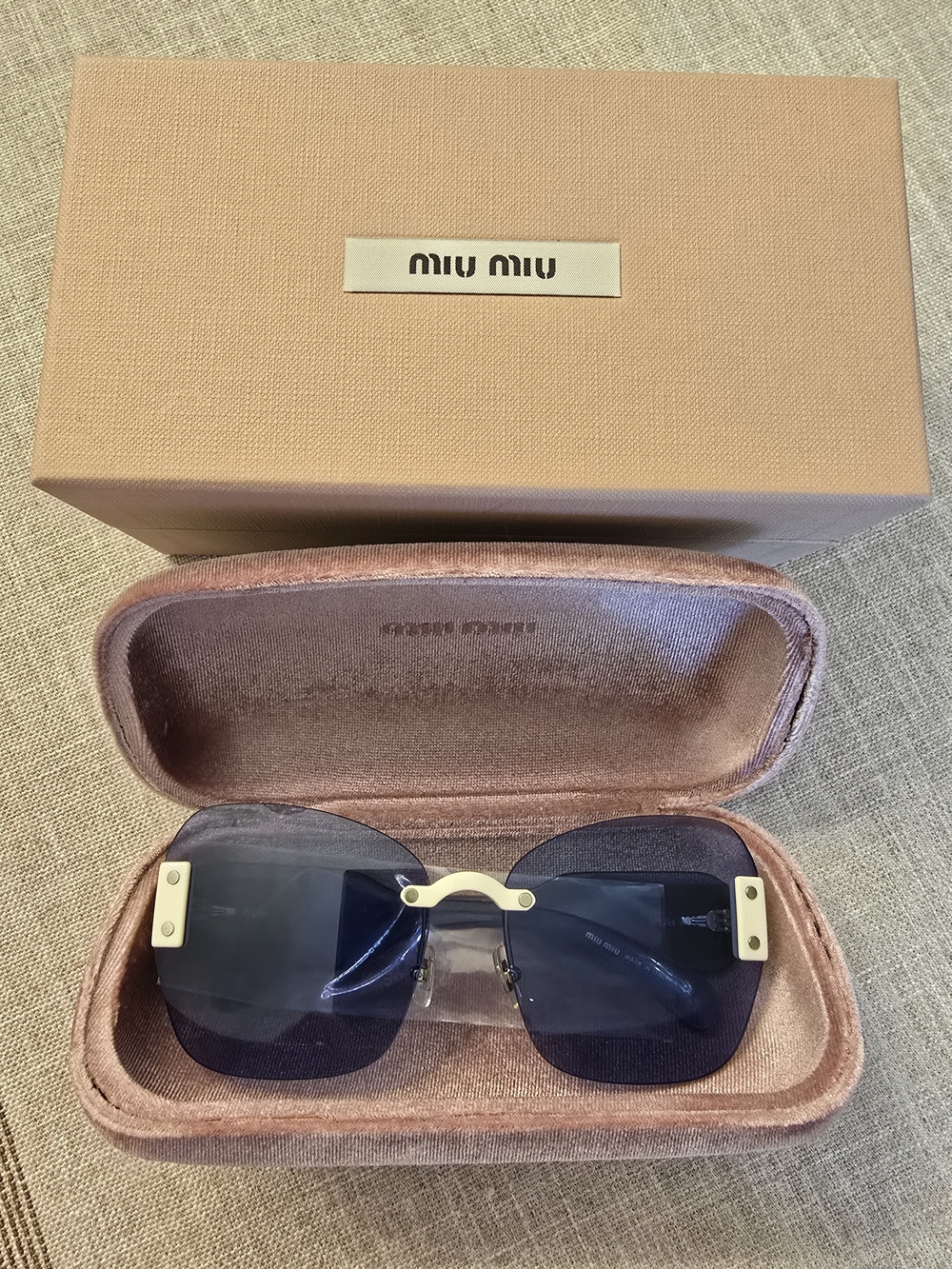 Miu Miu Rimless Sunglasses with Blue Lenses and Gold Accents - Picture 2 of 3